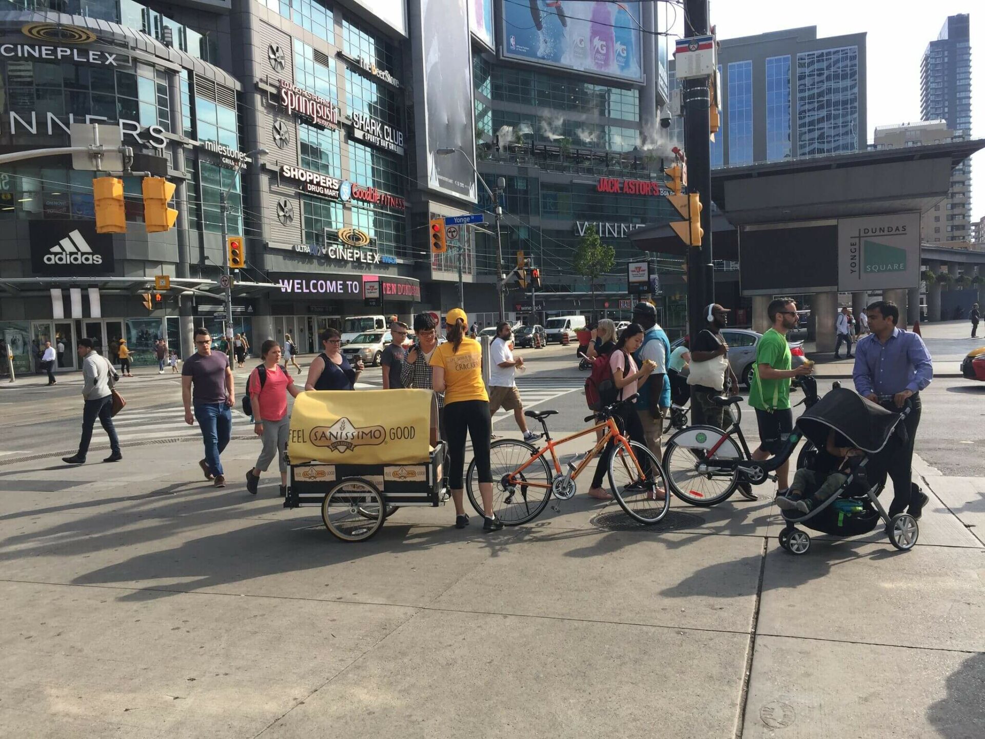 A group of people walking down the street.